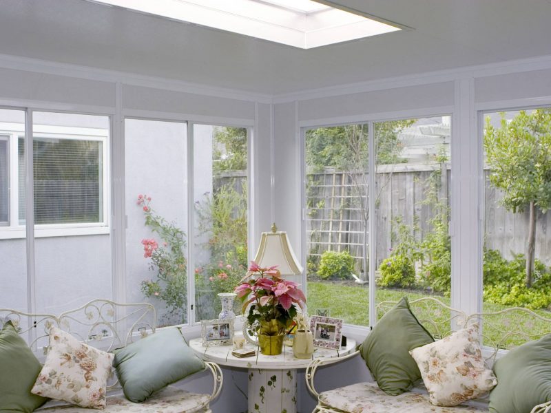 Interior of a Garden Romo showing a skylights, windows on all walls and furniture in Orange County, CA