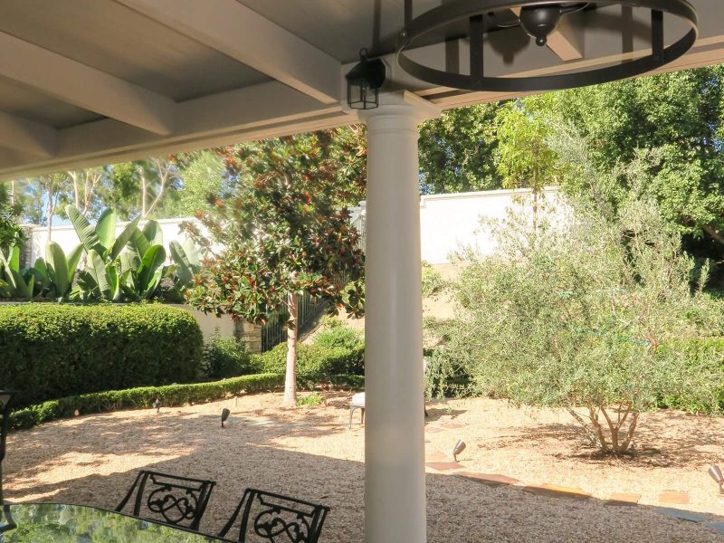 Underside of a Solid Insulated Patio Cover with a Roman column and an LED Light in Dove Canyon, CA