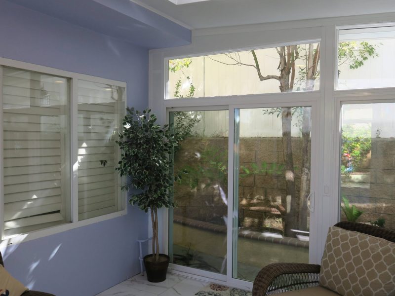 Interior of a Garden Room showing a skylight, windows on each wall and a sliding glass door in Trabuco Canyon, CA